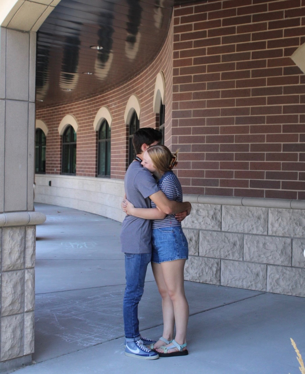A hug outside the high school
